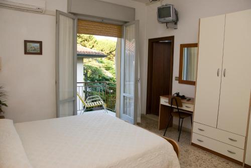 Postel nebo postele na pokoji v ubytování Hotel Carezza