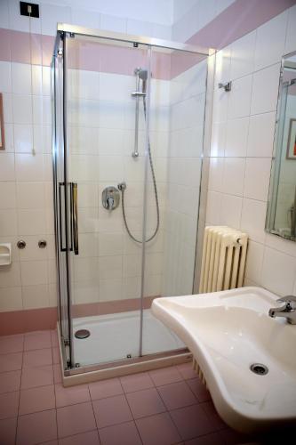 a bathroom with a shower and a sink at Hotel La Torre in Rimini