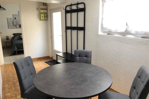 a dining room with a table and chairs at Gites des Lavandières in Cour-Cheverny