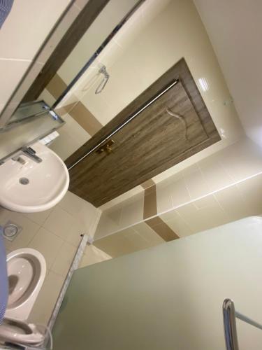 a bathroom with a sink and a toilet at Al-Mujeb in Kerak