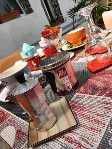 a table with a tea pot on a table at B&B Cappotto civico 48 in Pompei