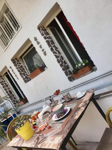 a table with food on it in front of a building at B&B Cappotto civico 48 in Pompei