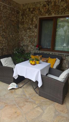 a table with fruit on it on a patio at Hotel Villa Monte in Cıralı