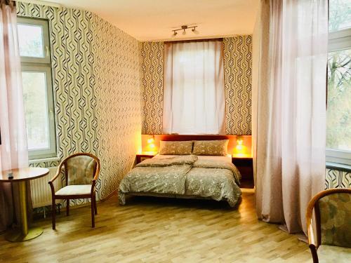 Łóżko lub łóżka w pokoju w obiekcie Landgasthof ht1