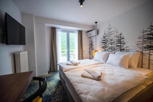 Ένα ή περισσότερα κρεβάτια σε δωμάτιο στο Hotel Plivsko jezero