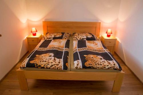 Postel nebo postele na pokoji v ubytování Apartmány v Pošumaví