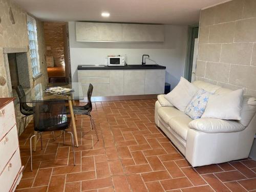 a living room with a couch and a table at Villa Antonella in Villasimius