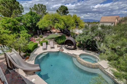 an overhead view of a swimming pool with a water slide at The Buddha Estate in Las Vegas