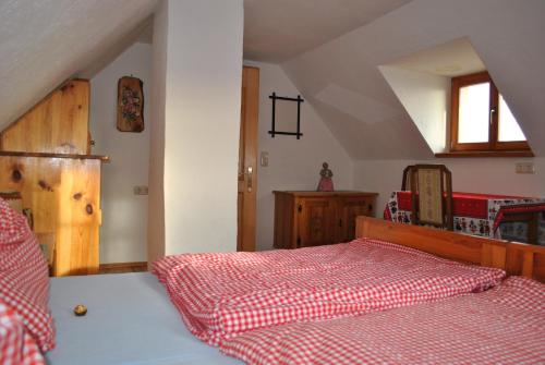 Postel nebo postele na pokoji v ubytování Schlintl-Hof