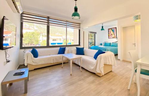 a living room with a couch and a table at Nur Suites & Hotels in Kalkan