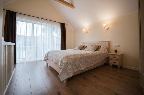 Postel nebo postele na pokoji v ubytování Kopa