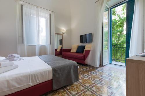 Voodi või voodid majutusasutuse Belmonte102 Esclusive Suites toas