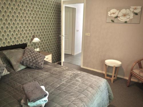 Ένα ή περισσότερα κρεβάτια σε δωμάτιο στο De Drie Beuken