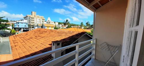 a balcony with a view of a city at Parada dos Golfinhos in Florianópolis