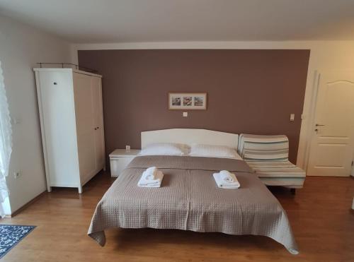 Ένα ή περισσότερα κρεβάτια σε δωμάτιο στο Ivana Apartman 2