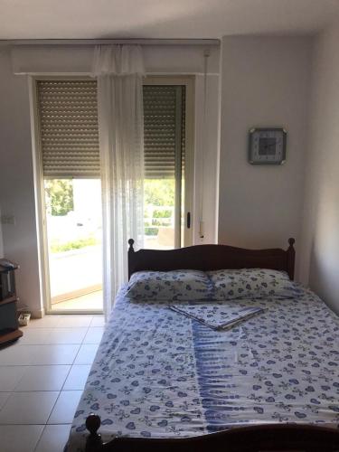 Postel nebo postele na pokoji v ubytování Geni Apartment