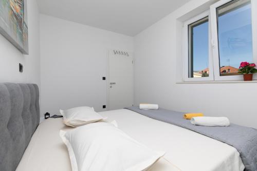 Postel nebo postele na pokoji v ubytování Apartment Viva