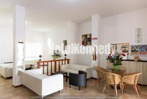 Postel nebo postele na pokoji v ubytování Hotel Kennedy