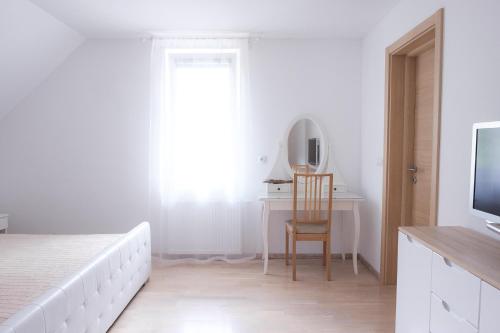 Ένα ή περισσότερα κρεβάτια σε δωμάτιο στο Villa Melody