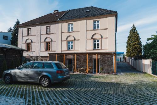 a car parked in front of a house at Penzion U Pivovaru in Děčín