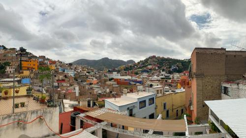 a view of a city with houses and buildings at Carcamanes 17 Gastro-Hotel in Guanajuato