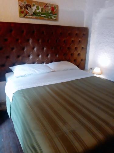 Cama o camas de una habitación en Hostal Gastro Bar Casa Colibrí