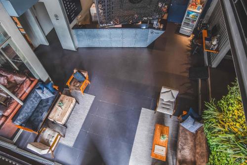 an overhead view of a living room with furniture at THA City Loft Hotel by TH District in Bangkok