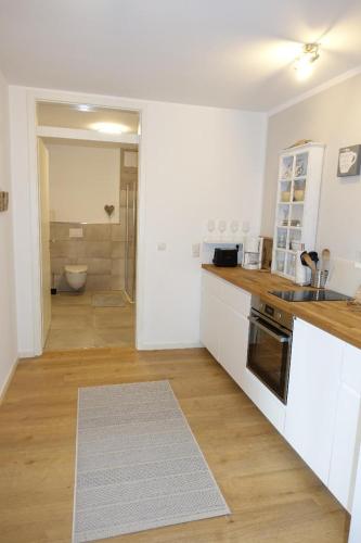 a kitchen with a sink and a counter top at Kleine Auszeit in Timmendorfer Strand