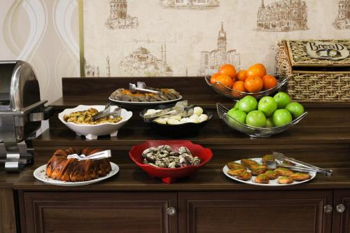 a buffet with different types of food on a table at Ayasultan Hotel in Istanbul