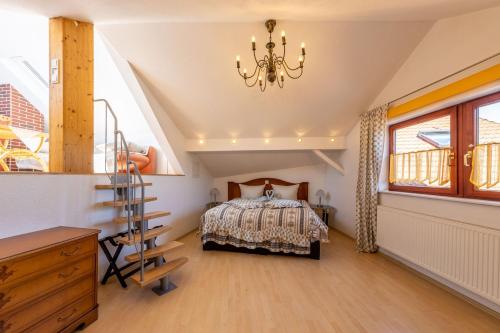 a bedroom with a bed and a staircase at Landgasthof Eschbacher Katz in Usingen