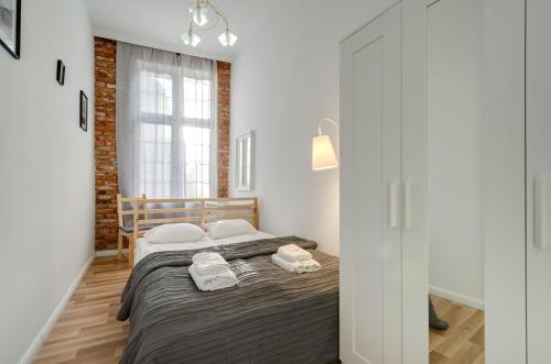 Posteľ alebo postele v izbe v ubytovaní Apartament Chlebnicka II