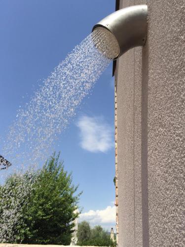 a water fountain coming out of the side of a building at La Locanda Paradiso in SantʼEgidio
