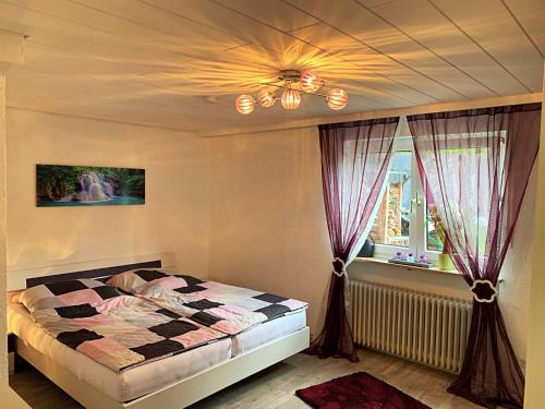 a bedroom with a bed and a ceiling at Ferienwohnung Familie Schott in Schwaig bei Nürnberg