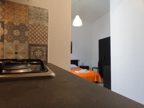 a kitchen with a stove top on a counter at Appartamenti Leone1 in San Vito lo Capo