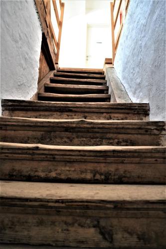 a set of stairs leading up to a white door at Höblinghof in Schwarzau im Gebirge