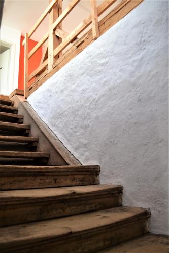 a set of stairs leading up to a white wall at Höblinghof in Schwarzau im Gebirge