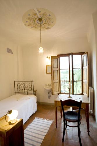 Katil atau katil-katil dalam bilik di Locanda Casanuova