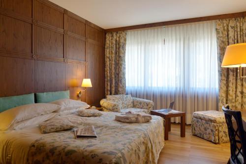 Savoia Palace Hotelにあるベッド