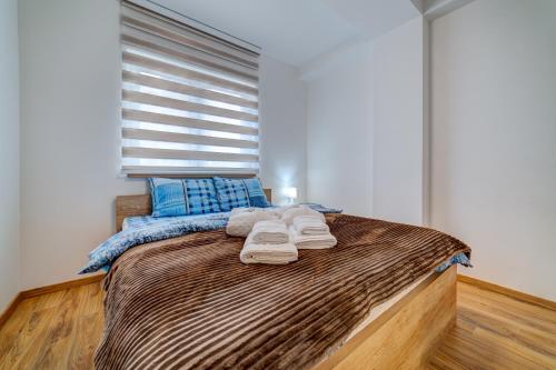 Postel nebo postele na pokoji v ubytování MB LUX APARTMANI