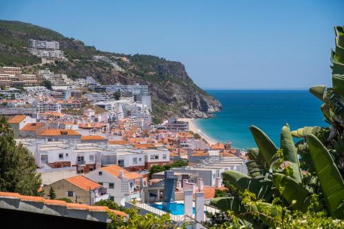 a view of positano on the amalfi coast at Rent4rest Sesimbra 4Bdr Ocean View and Private Pool Villa in Sesimbra