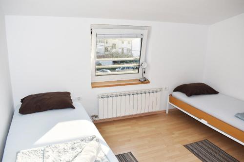Postel nebo postele na pokoji v ubytování Rooms Busija