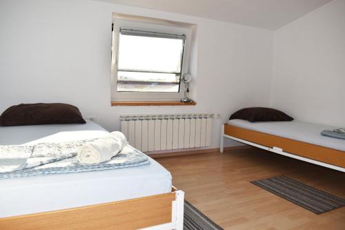 Postel nebo postele na pokoji v ubytování Rooms Busija