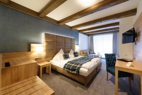 Säng eller sängar i ett rum på Hotel Alte Post