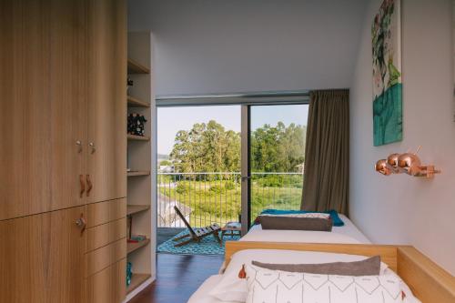 A bed or beds in a room at roomAREA vivienda turistica