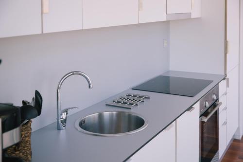 A kitchen or kitchenette at roomAREA vivienda turistica
