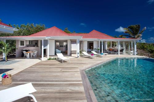 a villa with a swimming pool and a house at Dream Villa Mont Jean 661 in Saint Barthelemy