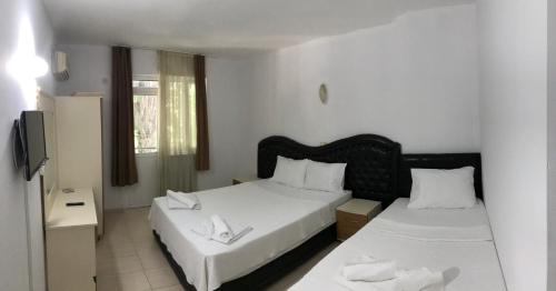 מיטה או מיטות בחדר ב-Moonlight Apart Hotel