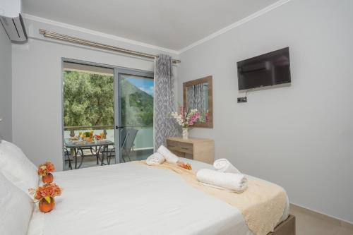 Posteľ alebo postele v izbe v ubytovaní Michaelangelo Apartments