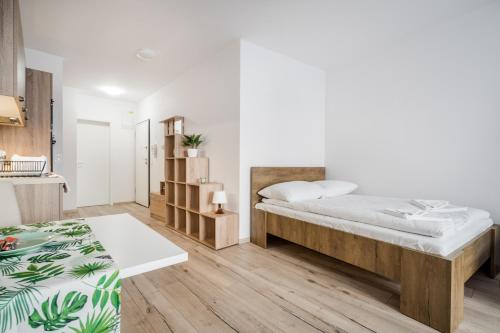Postel nebo postele na pokoji v ubytování BpR Brody Street Home