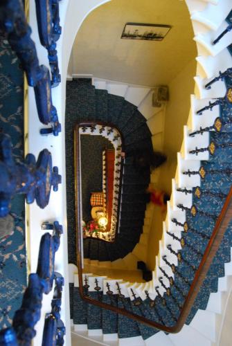 a staircase leading up to a staircase with a fire hydrant at Dene Guest House, New Town in Edinburgh